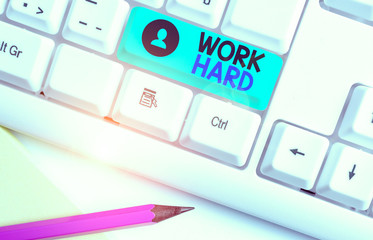 Writing note showing Work Hard. Business concept for Laboring that puts effort into doing and...