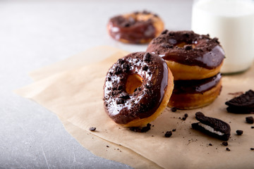 Pastries concept. Donuts with chocolate glaze and chocolate cookies