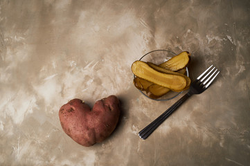 Ugly food, potatoes in the shape of a heart. Natural and simple farm products.