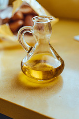 Bottle of oil with the golden juice of the olive.