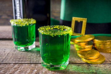 Drinks for St. Patrick's Day party. Good luck leprechaun shot cocktail. Green strong drink in a...
