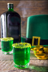 Drinks for St. Patrick's Day party. Good luck leprechaun shot cocktail. Green strong drink in a...