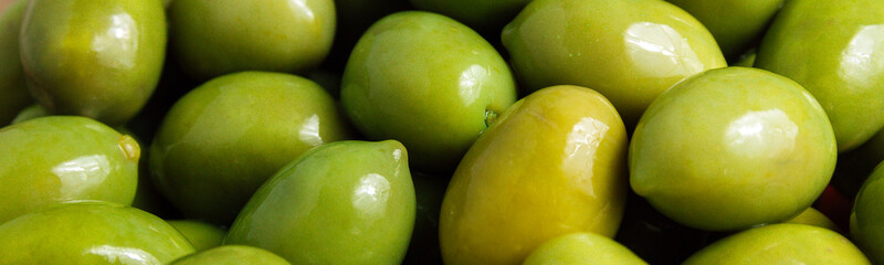 Banner of Green olives background. Top view.