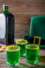 Drinks for St. Patrick's Day party. Good luck leprechaun shot cocktail. Green strong drink in a...