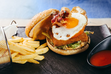 burger with eggs and fried cheese