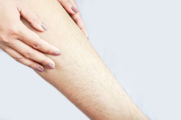 closeup woman with hairy, unshaven leg  