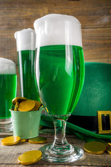 Traditional irish alcohol for St Patrick's day party. Different glasses with green beer, with...