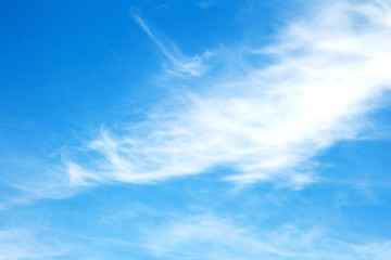 Background sky on a bright sunny day. Beautiful cumulus and cirrus thin clouds on a blue sky...