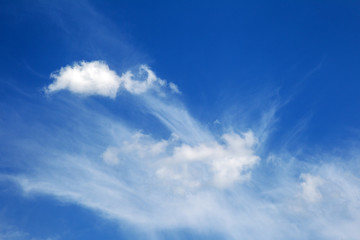 Naklejka na ściany i meble Background sky on a bright sunny day. Beautiful cumulus and cirrus thin clouds on a blue sky background. Blank for nature design