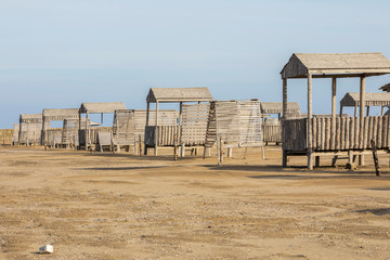 Beach arbors made of wood on an empty beach