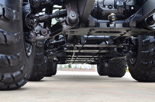 Lightweight fixed frame air suspension, air springs and shock absorbers on wheels with tyres. Truck suspension and steering linkage. Industrial workshop for the production of trucks and wheel chassis