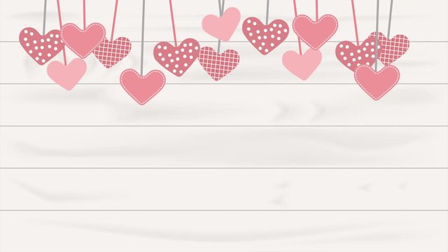 Hearts hanging on the white wooden background. Valentine&rsquo;s Day concept