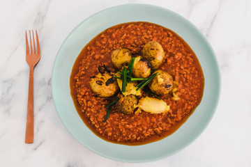 vegan bolognaise sauce with textured vegetable protein and oven baked potatoes