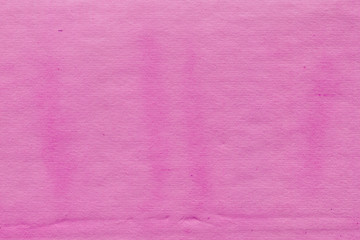 Fototapeta premium Cardboard pink abstract pattern texture close-up. Retro old paper background. Grunge concrete wall. Vintage blank wallpaper.