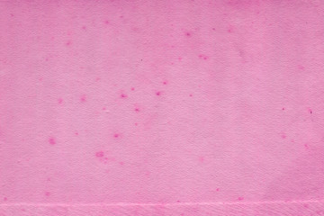 Cardboard pink abstract pattern texture close-up. Retro old paper background. Grunge concrete wall. Vintage blank wallpaper.