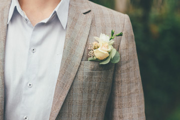 Groom with a boutonniere in a jacket