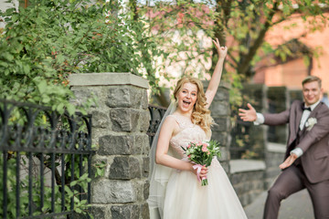 very happy bride and groom on a big city street.