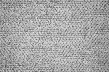Structure of gray terry fabric. Terry cloth close up photo.