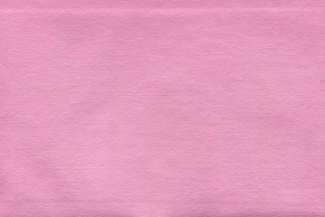 Fototapeta premium Cardboard pink abstract pattern texture close-up. Retro old paper background. Grunge concrete wall. Vintage blank wallpaper.