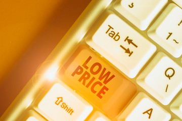 Writing note showing Low Price. Business concept for Price are the lowest in relation to other...