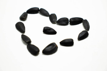  heart of sunflower seeds on a white background