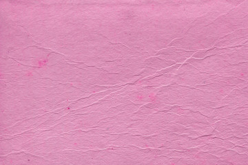 Cardboard pink abstract pattern texture close-up. Retro old paper background. Grunge concrete wall. Vintage blank wallpaper.