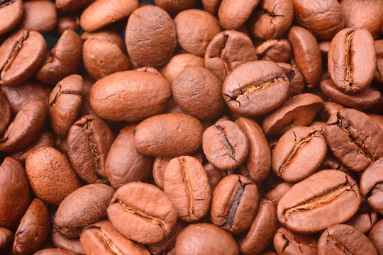 Roasted coffee beans, top view. Background image