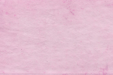Cardboard pink abstract pattern texture close-up. Retro old paper background. Grunge concrete wall....