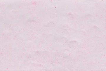 Cardboard pink abstract pattern texture close-up. Retro old paper background. Grunge concrete wall. Vintage blank wallpaper.