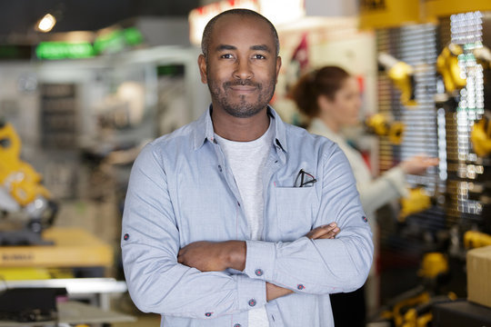 Successful Small Business Owner Standing With Crossed Arms