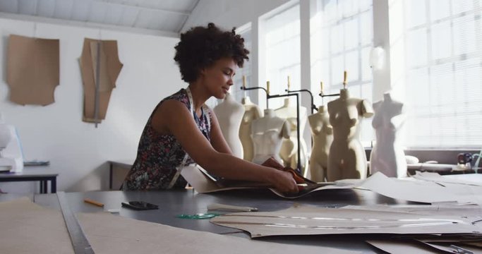 Mixed race woman working in creative office