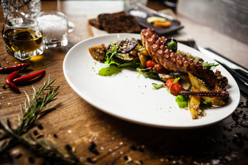 Octopus salad served on a plate in restaurant