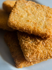  breaded fish on a white background