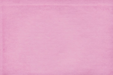 Fototapeta premium Cardboard pink abstract pattern texture close-up. Retro old paper background. Grunge concrete wall. Vintage blank wallpaper.