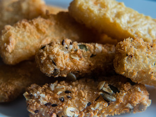  breaded fish on a white background
