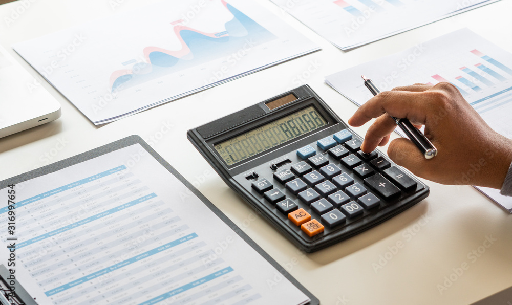 Aufkleber businessman working calculate data document graph chart report marketing research development planni