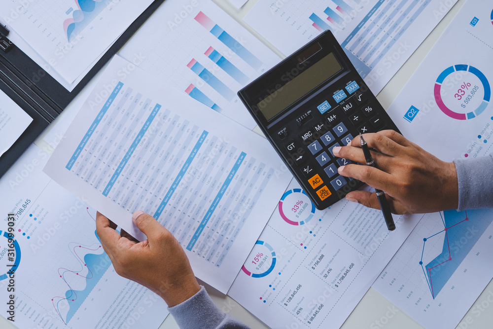 Aufkleber businessman working calculate data document graph chart report marketing research development planni