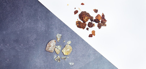 Natural incense crystals (resin). Brown and white resins on a graphite-white background.