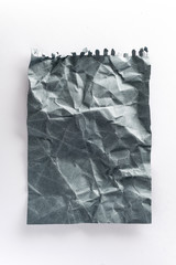 Obraz premium crumpled ball of gray paper on a white background. crumpled paper on white mocap paper