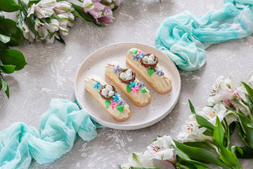 Fototapeta na wymiar Chocolate Marshmallows Eclairs with Easter Decor