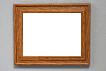 Vintage photo frame on the wall over grunge background.blank paper frames on white wall.