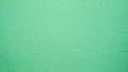 Green abstract background. Beautiful green textured stucco on the wall.