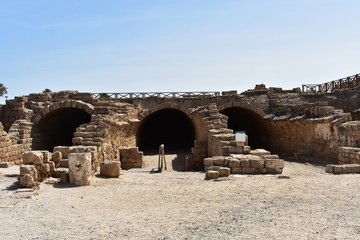 Ruins of the ancient city port of Caesarea. Caesarea was a Roman city named after the Caesar and...