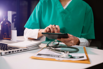 Medical technology concept. Doctor working with mobile phone and stethoscope and digital tablet...