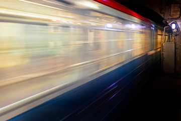 Fototapeta na wymiar Motion blur, speed of the train in subway, abstract background