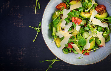Fresh salad tomato, avocado, corn salad, chia seed and parmesan. Healthy food concept. Vegetarian  cuisine. Dietary food. Top view, overhead