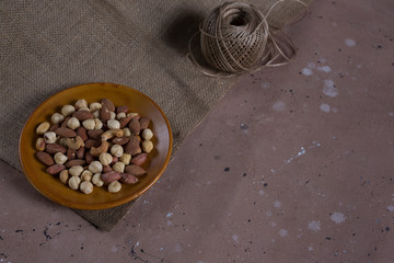 mixed nuts in brown bowl