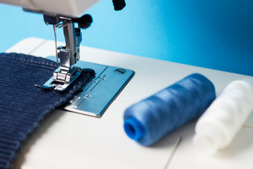  Sewing machine with fabric and thread for sewing, close-up. Working process.Sewing production
