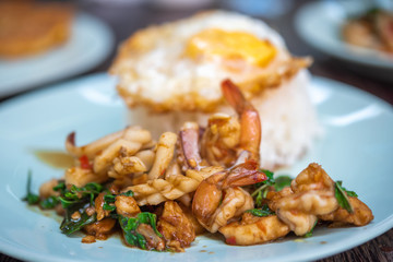 Stir fried spicy seafood with basil.