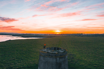 Naklejka premium Two People Are Enjoying The View From The Top Of The Tower.